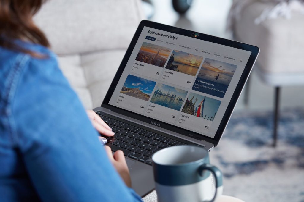 person searching for cheap spring break flights online