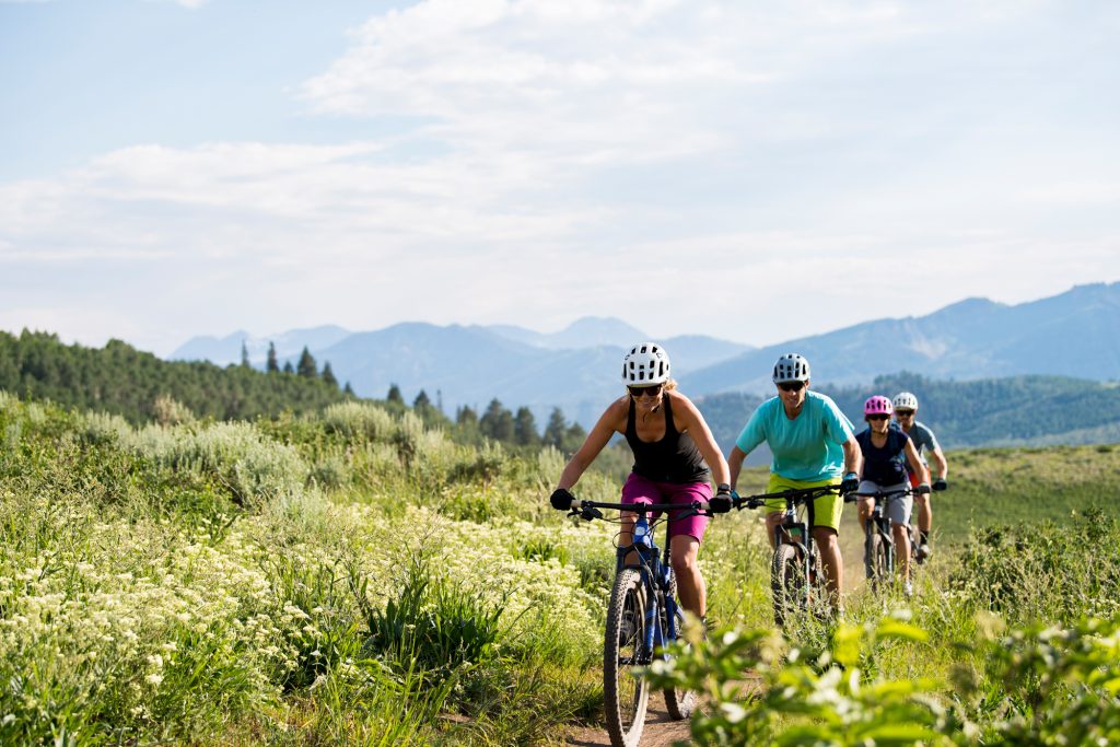 People enjoying cheap outdoor activities in a public park in the United States
