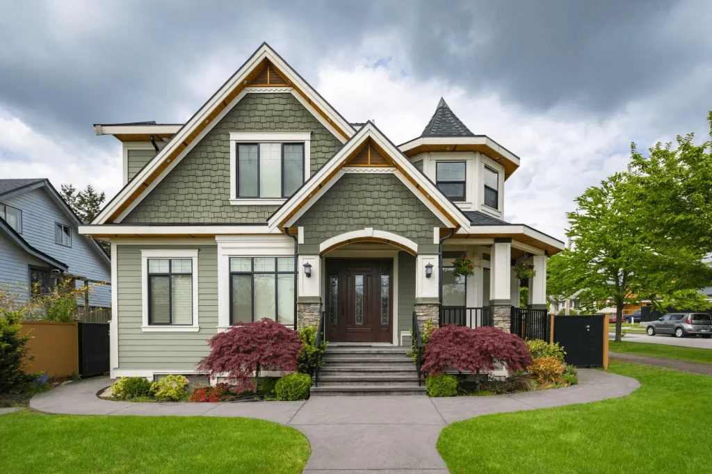 Happy homeowner standing in front of affordable North Carolina house
